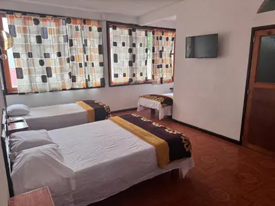 Cama o camas de una habitación en Posada Quetzalin