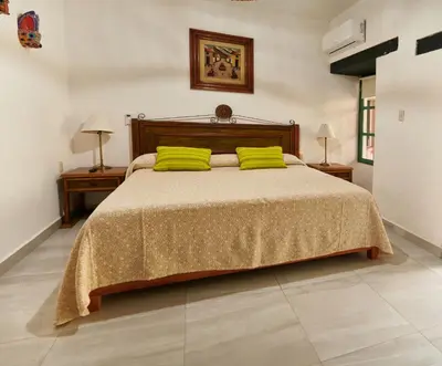 Cama o camas de una habitación en Hotel Mansión Chiapa