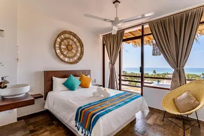Cama o camas de una habitación en Punta Kai Hotel & Hostal