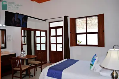 Cama o camas de una habitación en Hotel del Capitán de Puebla