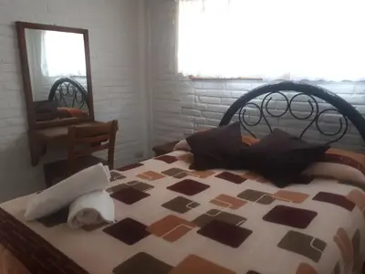 Cama o camas de una habitación en La Misión Hotel Chignahuapan