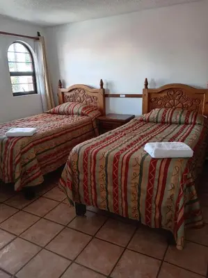 Cama o camas de una habitación en Villas Tonantzintla