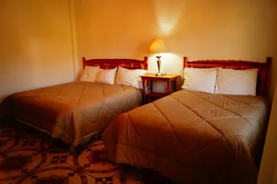 Cama o camas de una habitación en Hospedaje La Hoja