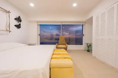 Cama o camas de una habitación en Maravilloso departamento frente al mar, Acapulco