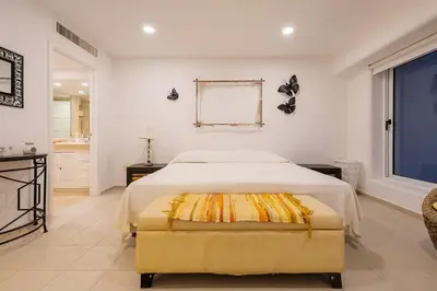 Cama o camas de una habitación en Maravilloso departamento frente al mar, Acapulco