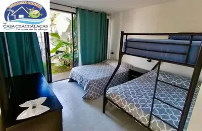 Cama o camas de una habitación en COQUITO HOUSE CHACHALACAS