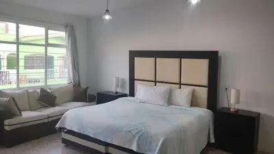 Cama o camas de una habitación en PROVENZA HOTEL & SUiTES