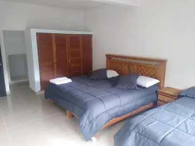 Cama o camas de una habitación en Hospedaje Anayauhcalli