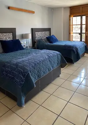 Cama o camas de una habitación en Posada Catalina