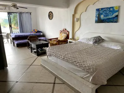 Cama o camas de una habitación en Gran habitacion con terraza vista espectacular, piscina