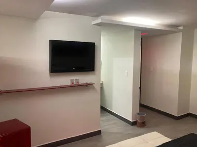 Una televisión o centro de entretenimiento en HOTEL HUIPULCO