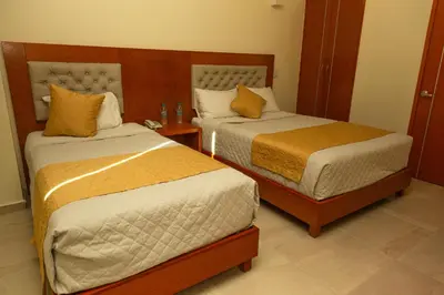 Cama o camas de una habitación en PH Hotel