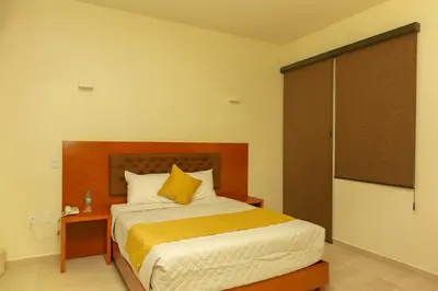 Cama o camas de una habitación en PH Hotel