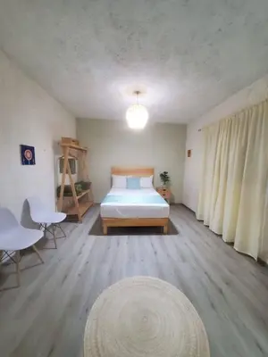 Cama o camas de una habitación en Alojamiento el nixtamal