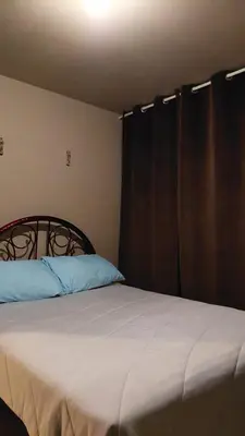 Cama o camas de una habitación en Relajacion Cercas Del Aeropuerto