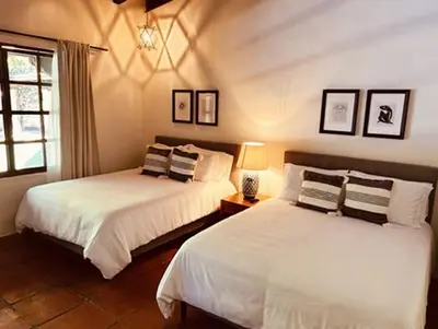 Cama o camas de una habitación en Villa Tatala hotel boutique