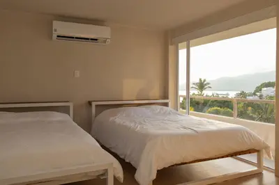 Cama o camas de una habitación en Casa con vista a la bahía
