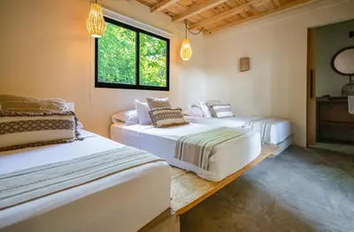 Cama o camas de una habitación en Raíz Hotel Boutique