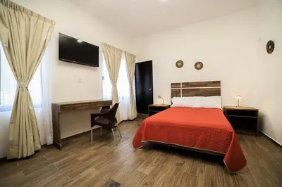 Cama o camas de una habitación en Capital O Hotel Boutique Las Torres