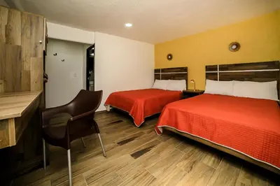 Cama o camas de una habitación en Capital O Hotel Boutique Las Torres