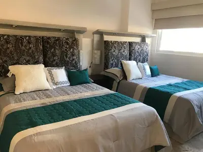 Cama o camas de una habitación en Departamento en Acapulco con inmejorable vista