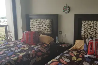 Cama o camas de una habitación en Precioso departamento en Acapulco Diamante