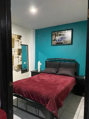Cama o camas de una habitación en Bonito Departamento Verde con terraza