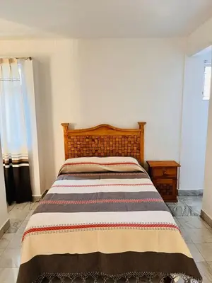 Cama o camas de una habitación en Habitaciones LEONOR