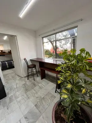 Una cocina o zona de cocina en Habitaciones LEONOR