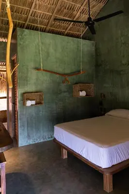 Cama o camas de una habitación en COCOS HOTEL
