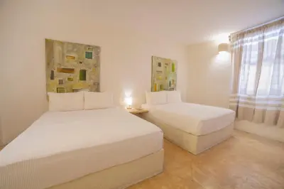 Cama o camas de una habitación en HOTEL BIULÚ