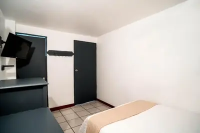 Cama o camas de una habitación en Marqués Oaxaca - Hotel