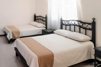 Cama o camas de una habitación en Marqués Oaxaca - Hotel