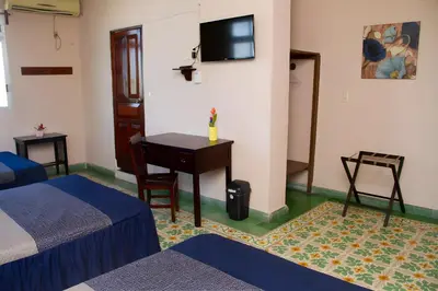 Una televisión o centro de entretenimiento en Hotel Cortaza Galería