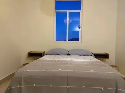 Cama o camas de una habitación en Moderno y Tradicional, elegante departamento en Oaxaca