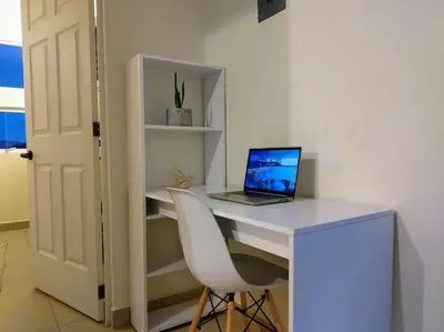 Una televisión o centro de entretenimiento en Moderno y Tradicional, elegante departamento en Oaxaca