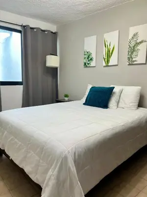 Cama o camas de una habitación en Departamento Cumbres