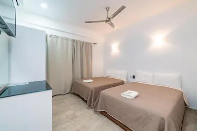 Cama o camas de una habitación en Mi Querida Maribel Hotel