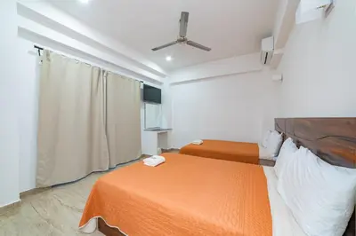 Cama o camas de una habitación en Mi Querida Maribel Hotel