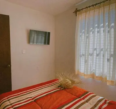 Cama o camas de una habitación en Casa Amapolas Oaxaca