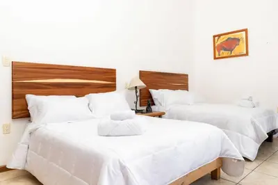 Cama o camas de una habitación en Casona San Germán - Alojamiento para 14 personas en Oaxaca