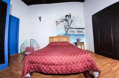 Cama o camas de una habitación en Gente de Más Hostel