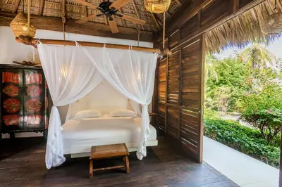 Cama o camas de una habitación en Oceanfront Casa Rhino