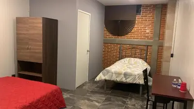 Cama o camas de una habitación en Suite Aries
