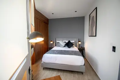 Cama o camas de una habitación en Punto Lofts Periférico Sur
