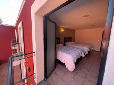 Cama o camas de una habitación en Hotel Casa Real Cholula