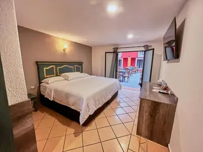 Cama o camas de una habitación en Hotel Casa Real Cholula