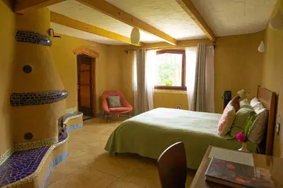 Cama o camas de una habitación en El EQUIMITE HOTEL BOUTIQUE