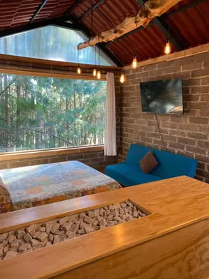 Cama o camas de una habitación en Cabaña en el bosque