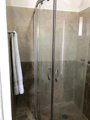 Un baño de Departamento Zeus 12